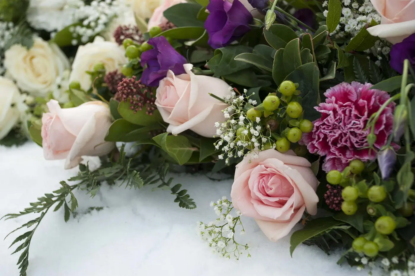 colorful flowers ontop of casket