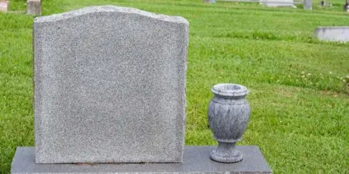 Headstone and vase in a cemetery